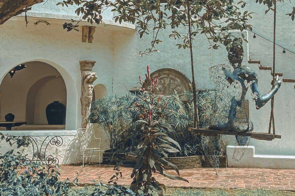 The outdoor garden and swing sculpture at Pinto Art Museum
