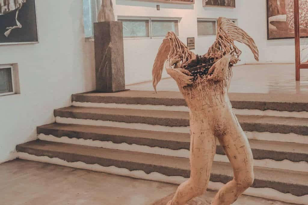 A winged sculpture inside Pinto Art Museum, one of many art pieces scattered throughout the galleries