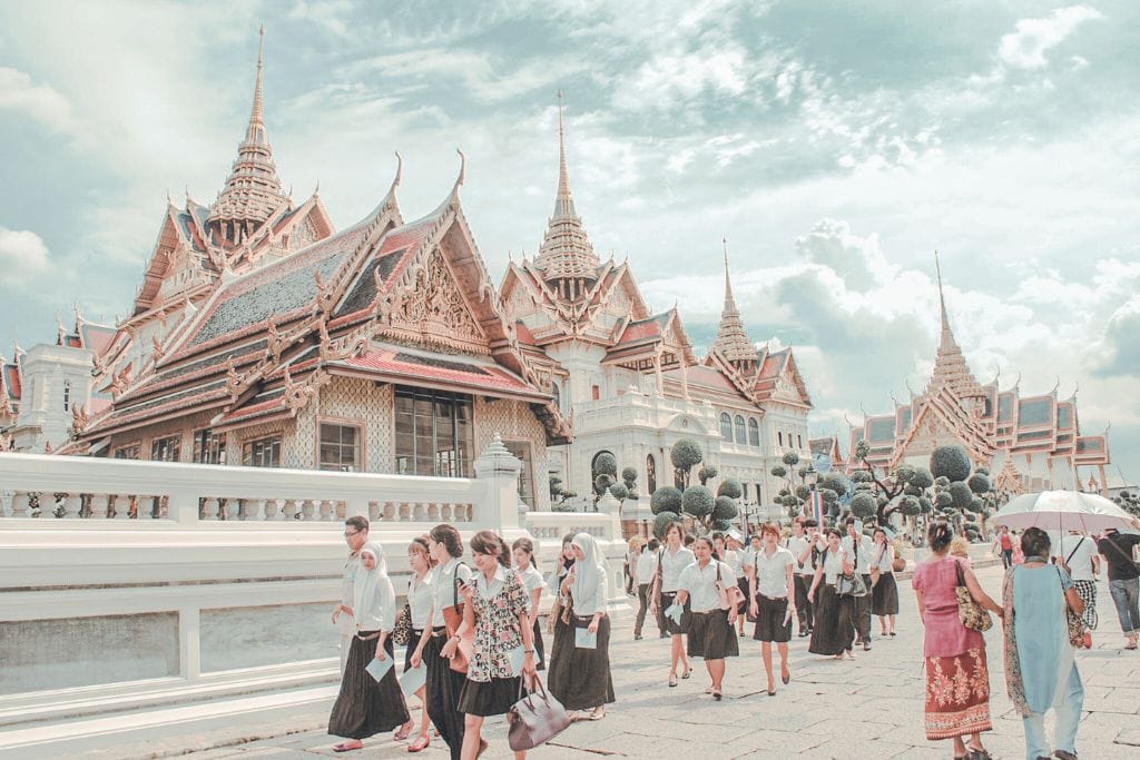 Students walking in the Grand Palace grounds in Bangkok, Thailand. Include a visit to the Grand Palace to your Thailand itinerary