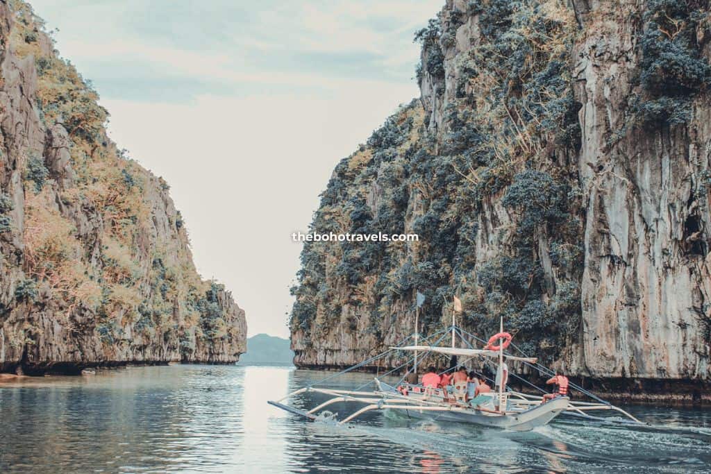 boat passing through a lagoon in El Nido