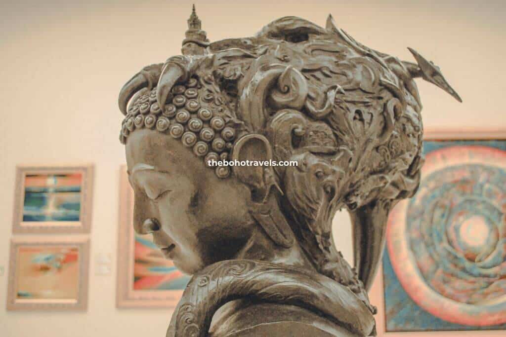 admiring this fascinating artwork at MOCA in Thailand, one of the best things to do in Bangkok if you're an art lover