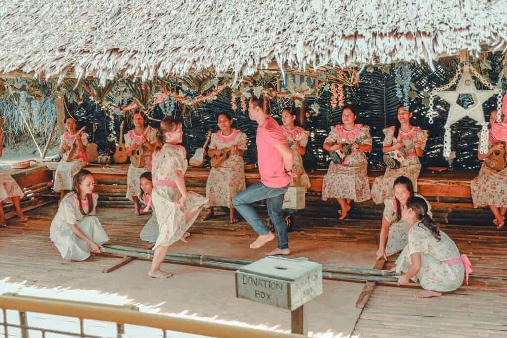 Folk performers dancing for tourists on the Loboc River cruise in Bohol